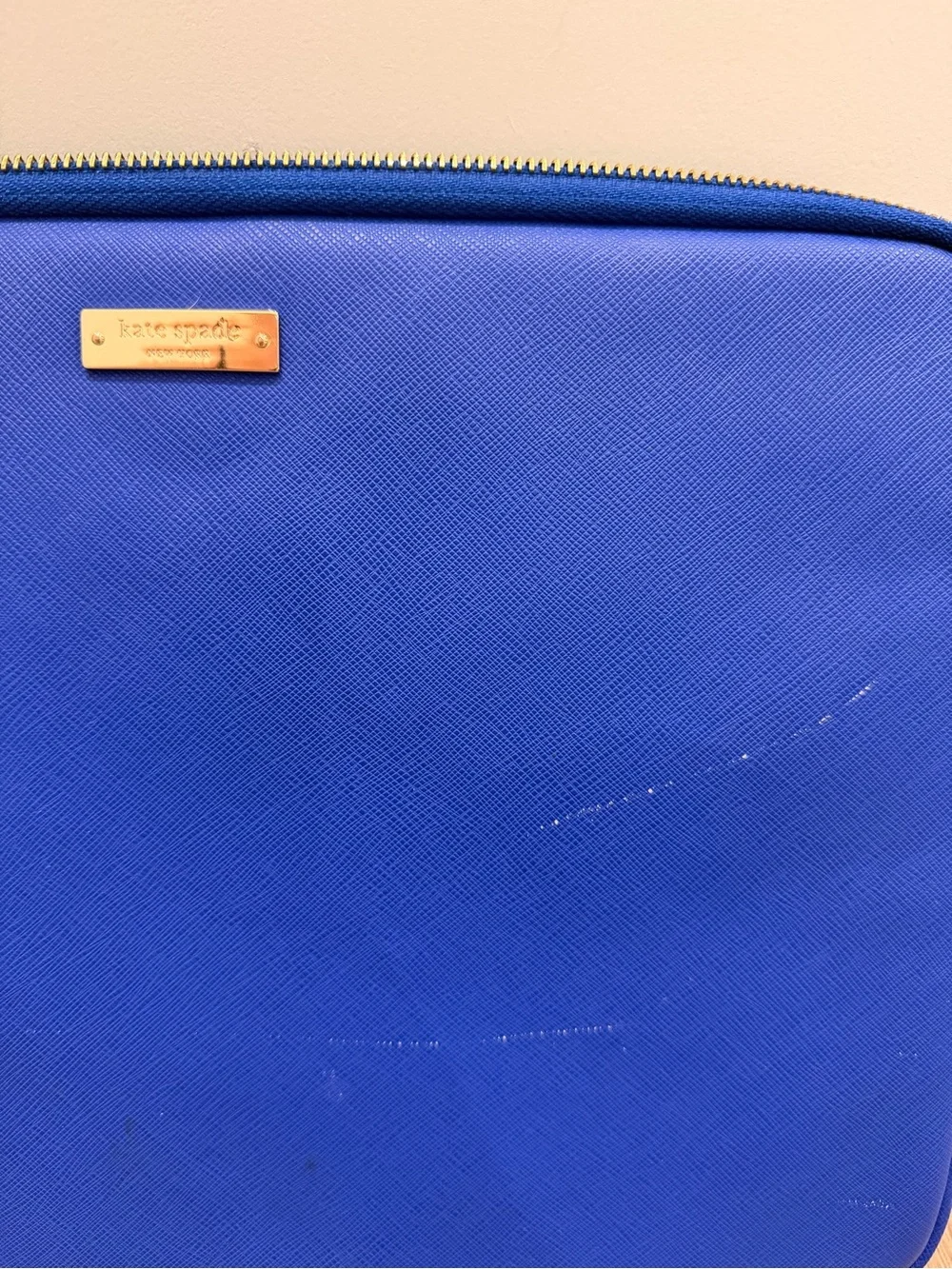 kate spade royal blue zip laptop sleeve with gold logo